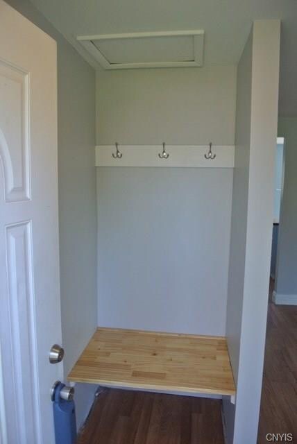 A bench and place for coats greet you when you enter the front door.