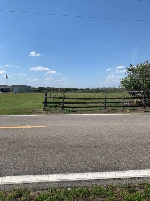 Left side of road front-barbed wire fence connects