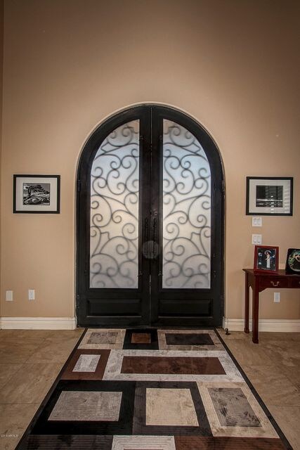 Foyer with double iron doors