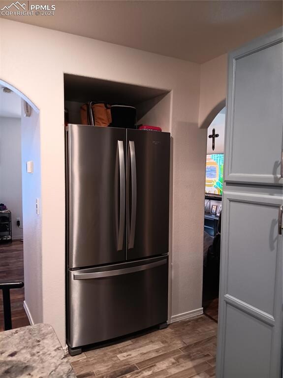 Kitchen featuring stainless steel refrigerator and