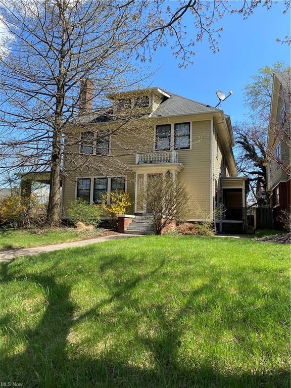 There is a front stoop and each side has a porch as well as one in the back.