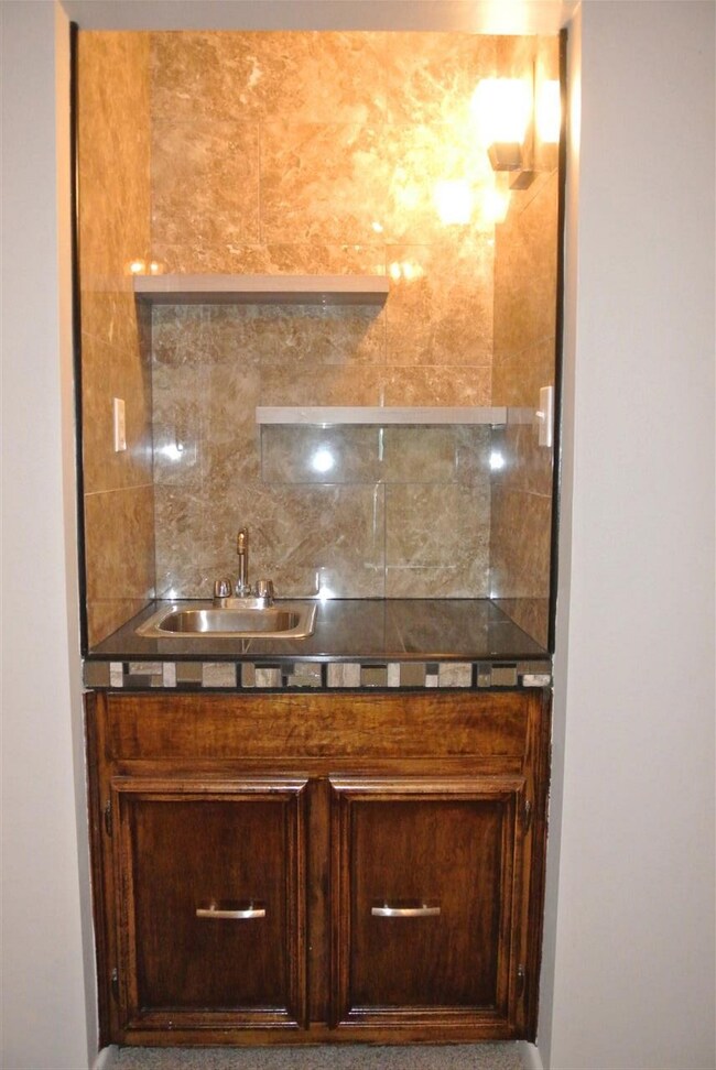 Updated wet bar with new lighting, counter tops, b