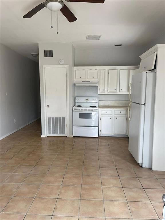 Kitchen with white appliances, light tile patterned floors, white cabinets, a ceiling fan, and light countertops