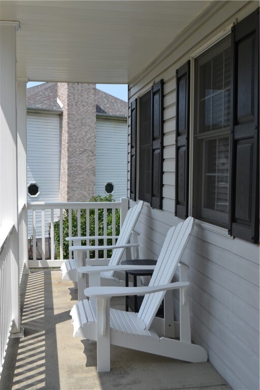 Covered front porch with maintenance free railings.