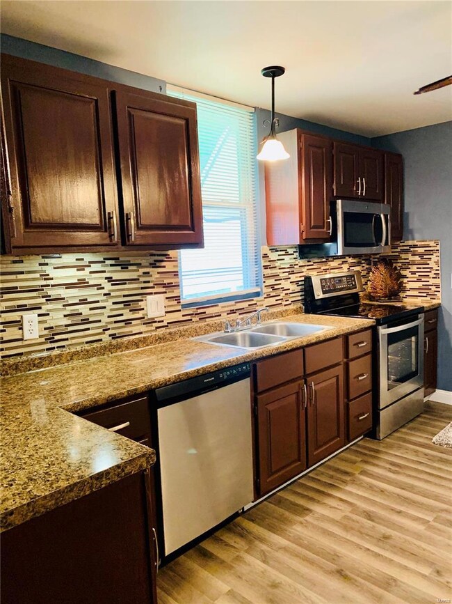 Kitchen has been renovated and looks classy! Refinished cabinets, new counter top and stainless appliances. Under cabinet accent lights remotely controlled. New sink and faucet as well.