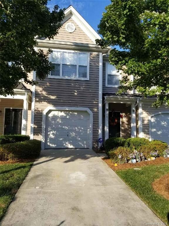 Beautifully Manicured Front Yard, with Finished 1 car Garage and 2 Car Drive