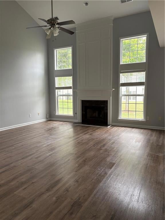 Unfurnished living room with dark wood finished fl