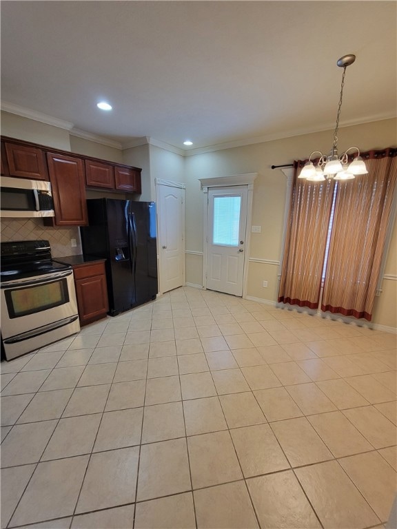 Kitchen with stainless steel appliances, crown molding, light tile patterned flooring, tasteful backsplash, and a chandelier