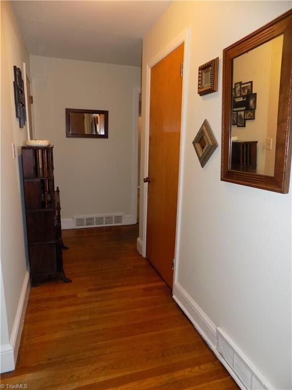 Spacious Entry way with Coat Closet, notice the beautiful hardwoods!