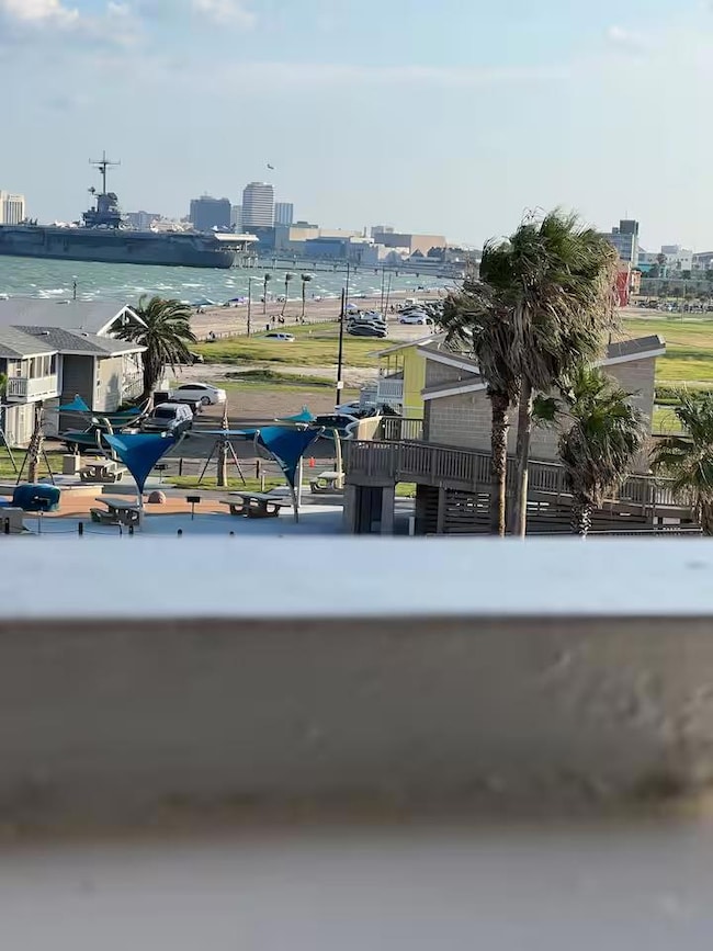 View of community with a city view and a water view
