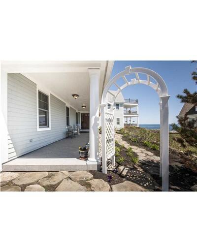 Facade/Exterior Front. Entryway to...