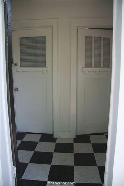 Hallway with dark floors