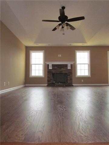 Living room with fire place and high ceilings. 