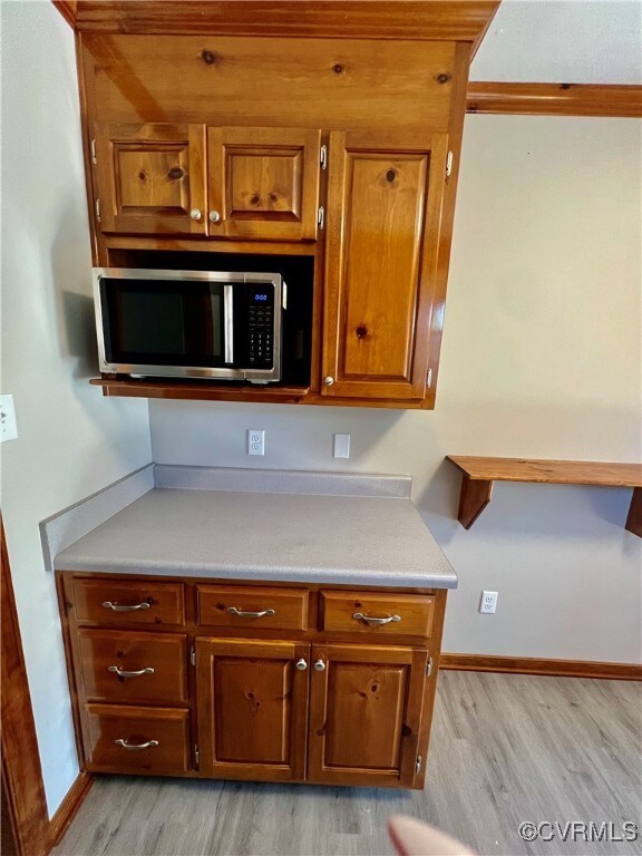 Kitchen with light wood-type flooring
