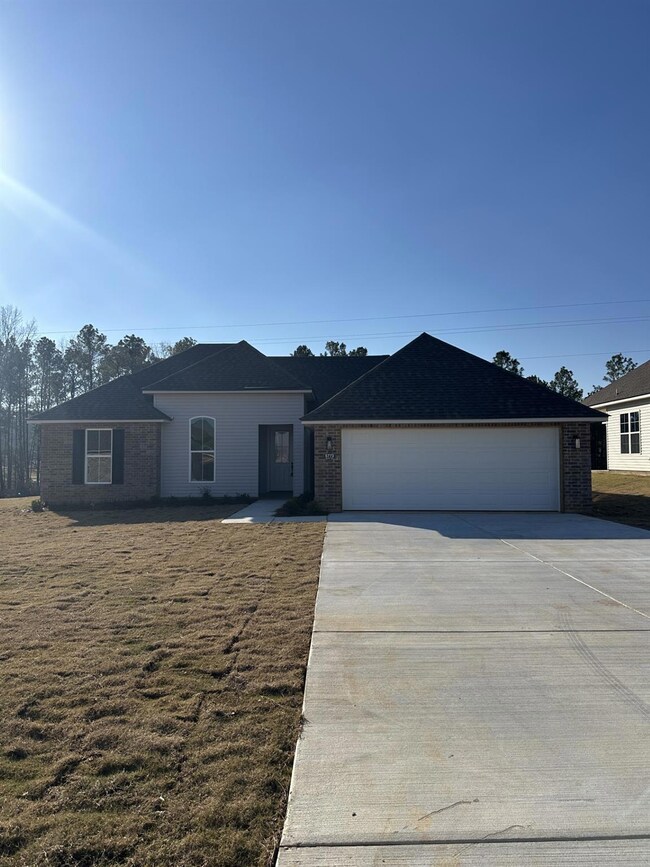 View of front of house featuring a garage and a fr