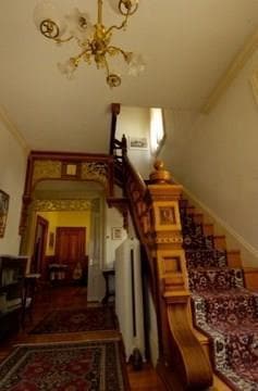 Arched doorways, wide board floor...