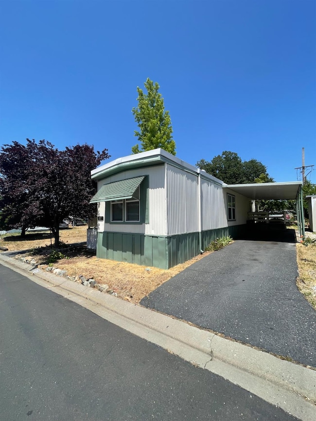 Front with driveway/carport