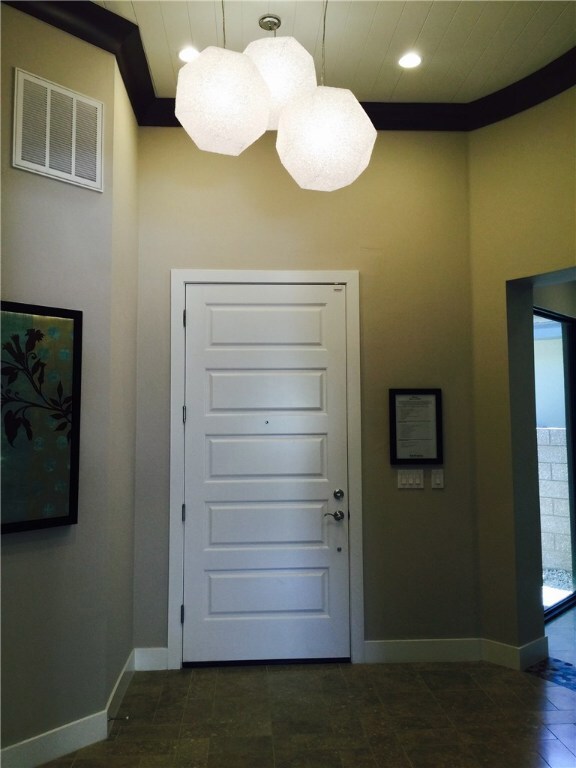 Photos are of the Gilmore model home entry foyer a