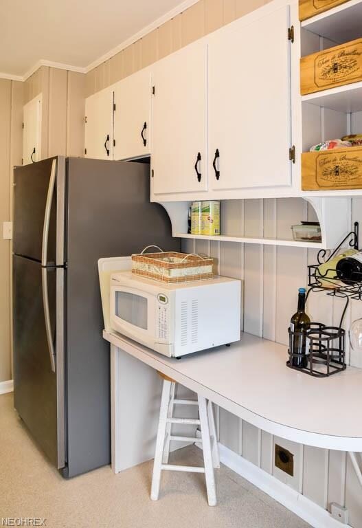 The kitchen has a breakfast bar and deep pantry.