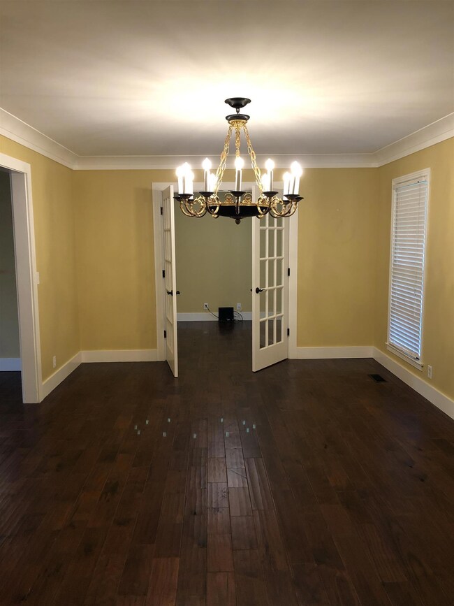 A view from the foyer into the dining and additional room that would make a great office