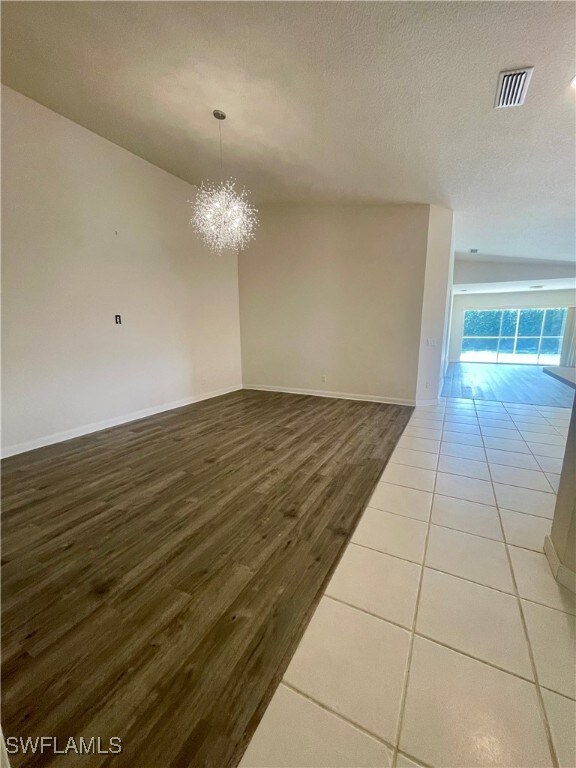 Unfurnished room featuring wood finished floors, a