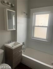 Full bathroom with vanity, shower / bathing tub combination, and toilet