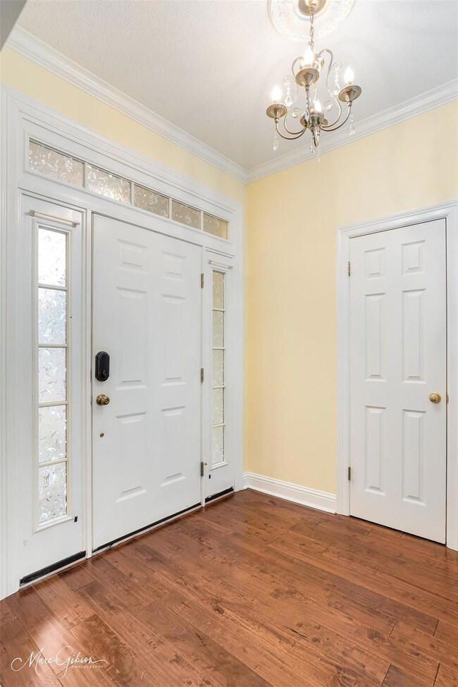 Entryway featuring ornamental molding, a notable c