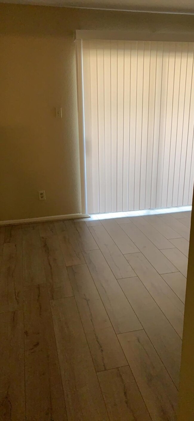 Master bedroom showing screen door to the patio