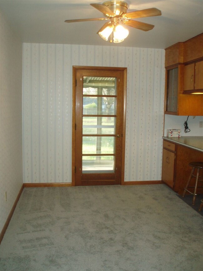 door accesses the back screened in porch