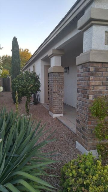 Landscaped front yard with auto sprinkle