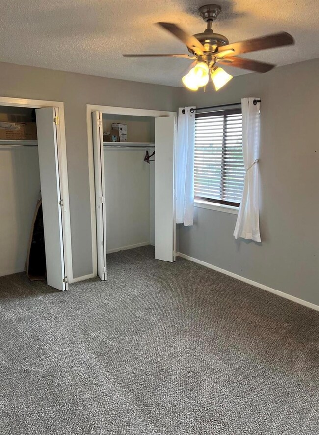 Unfurnished bedroom featuring a textured ceiling, 
