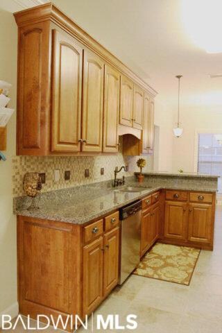 Gourmet kitchen with stainless steel appliances, l