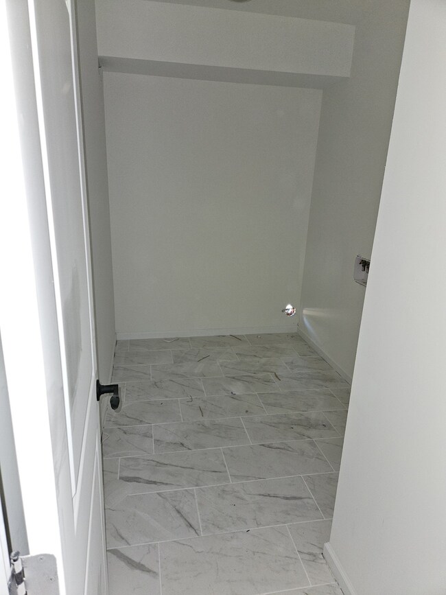 Sizeable Laundry Room Down
