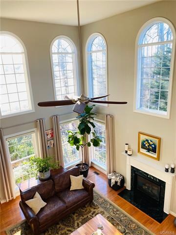 Dramatic 2-story Great Room with arched windows an