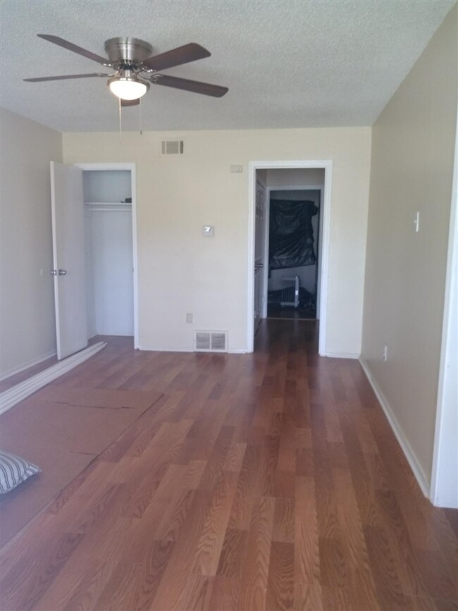 Spacious room with new wood laminate floors