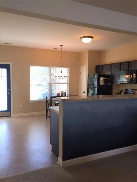Living Room opens into eat In kitchen