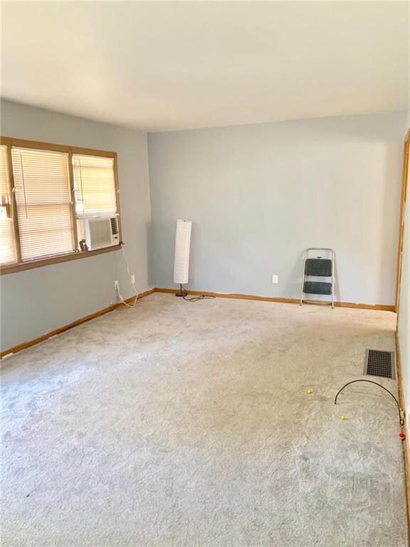 Great room - new carpet, with hardwood flooring un
