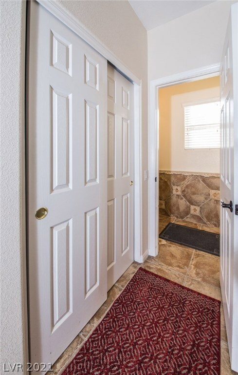 Down Stairs Hallway to Laundry and Powder Room