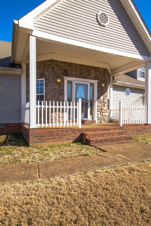 Stone Front Entrance with Rocking Chair Front Porch