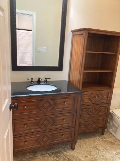 Matching vanity and storage with granite counter t