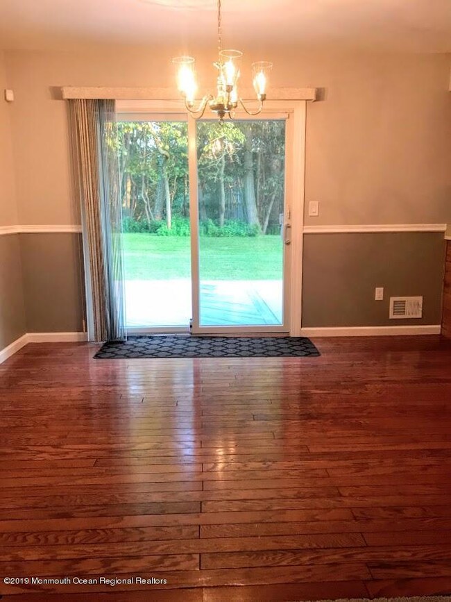 DINING AREA WITH SLIDERS TO PRIVATE YARD