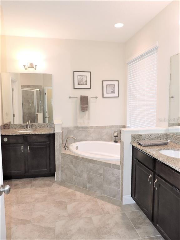 His & Hers vanities and a beautiful garden tub