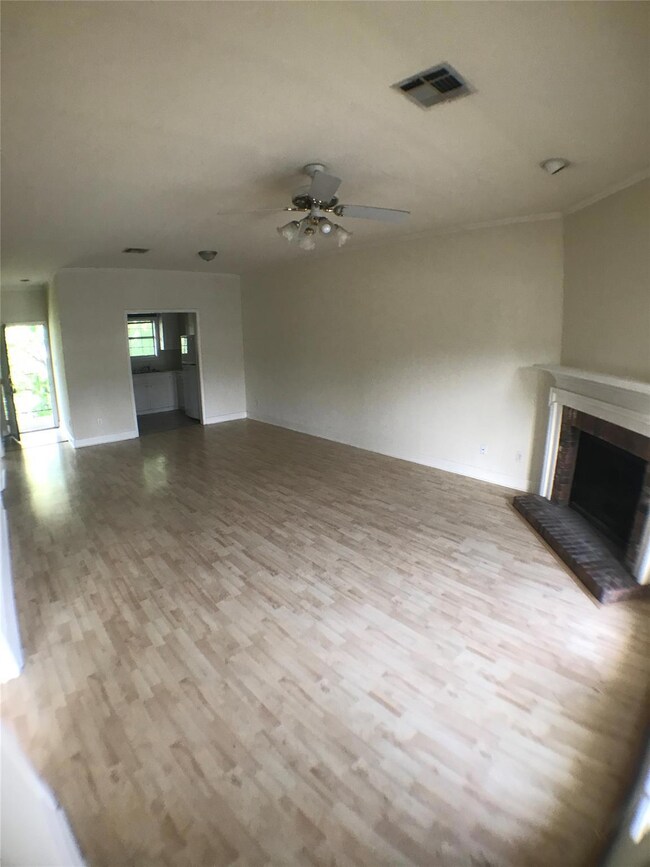 Unfurnished living room with wood finished floors