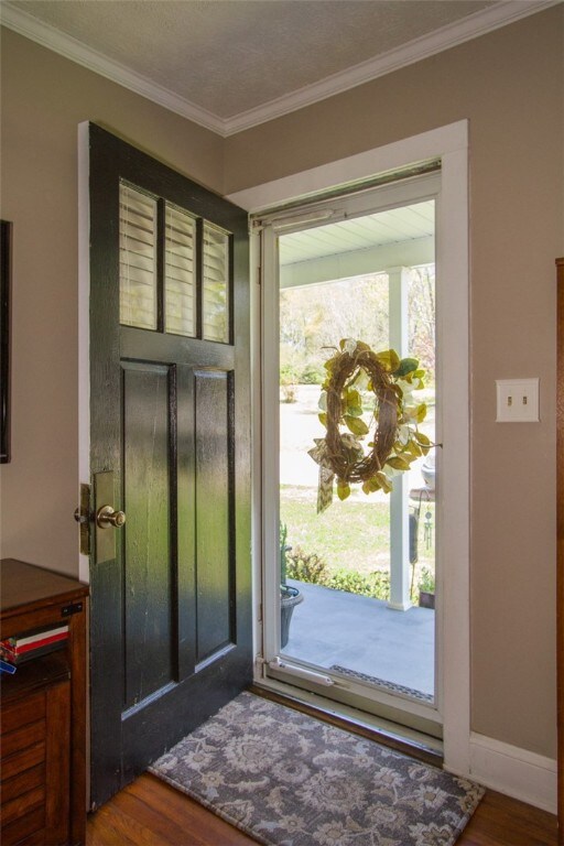 Front door entry into Living room with original ha