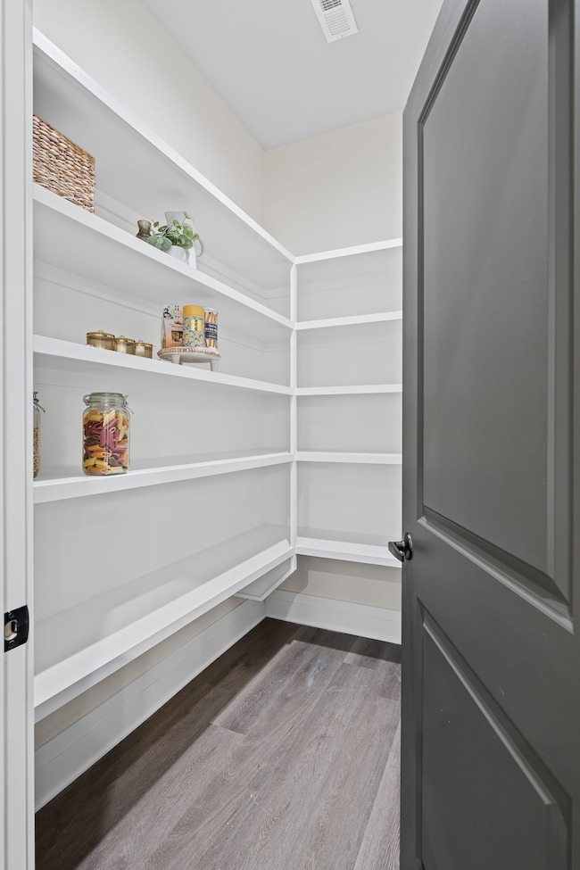 Spacious Walk In Pantry with Custom Cabinetry.
