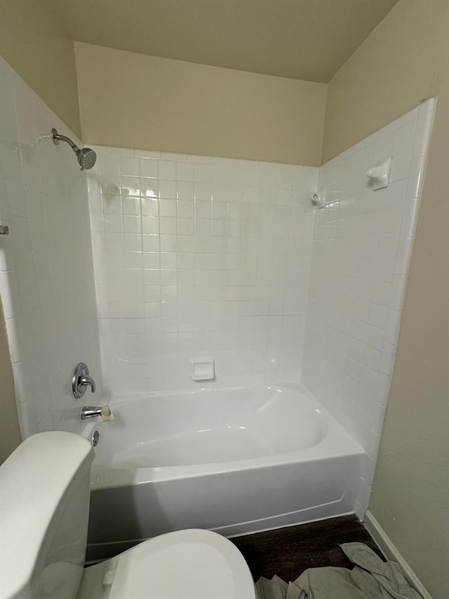 Full bath with bathtub / shower combination and toilet