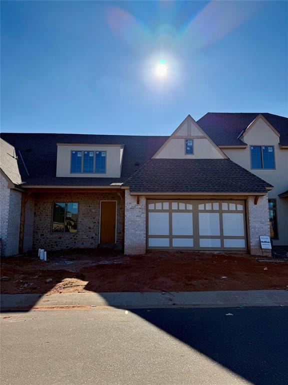 View of front of home featuring a garage