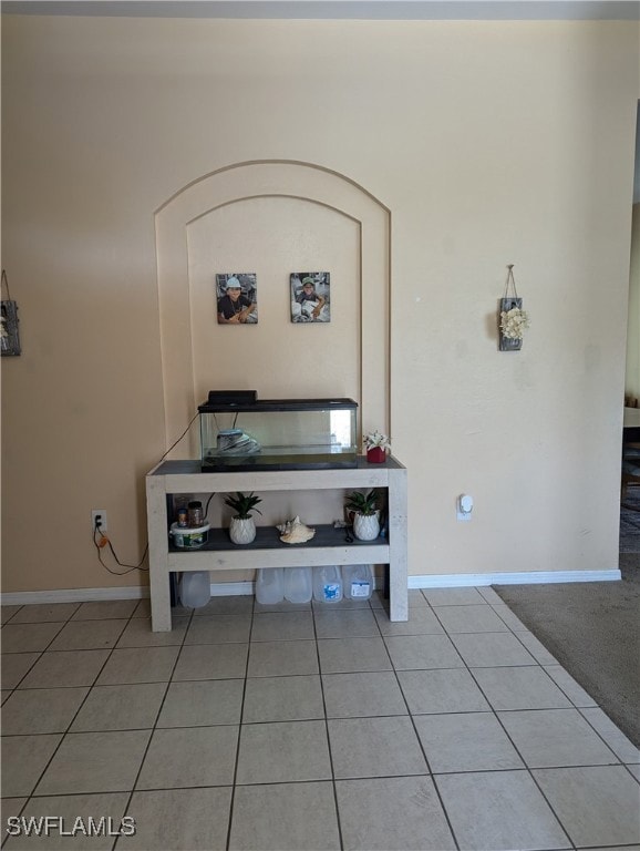Detailed view of baseboards and arched walkways