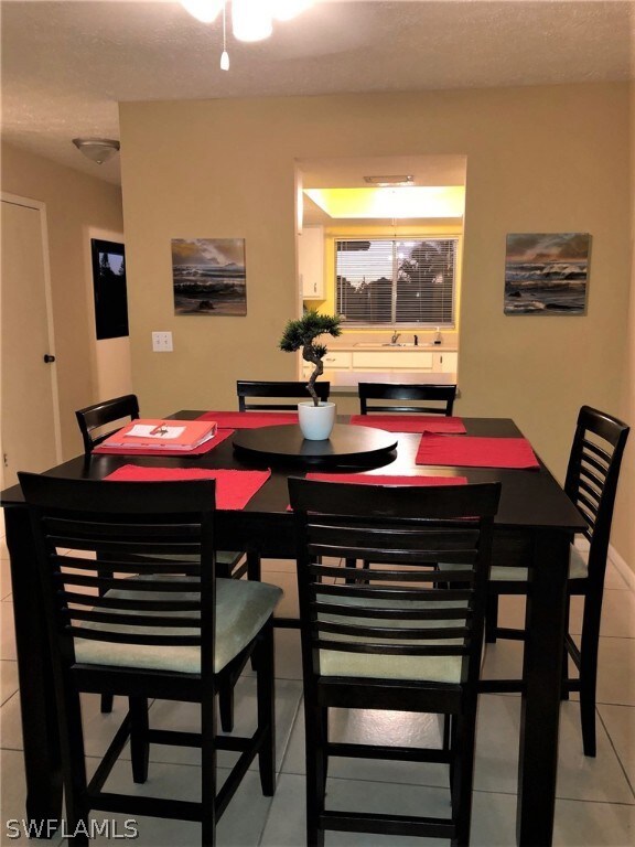 Dining room + view of kitchen pass thru.