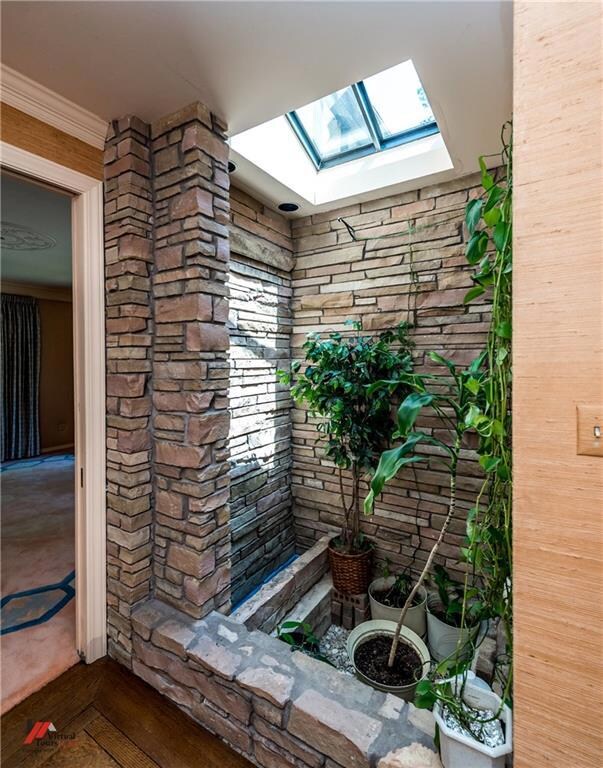 Stone atrium with skylight.